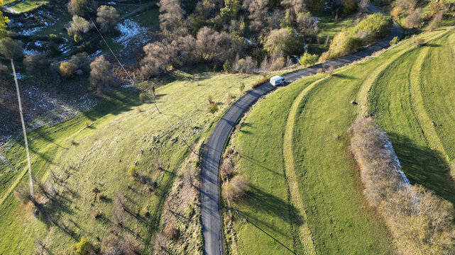 Aerial view of scenic countryside with winding road, fields, and trees, Posof, Ardahan, Turkiye.