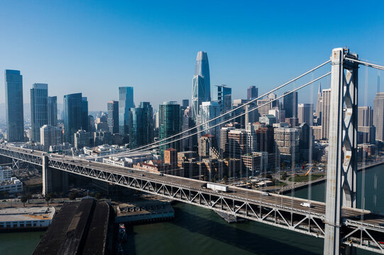 Aerial view of the beautiful skyline featuring skyscrapers and the iconic Bay Bridge, San Francisco, California, United States.
