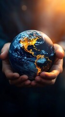 Hands cradling a glowing earth, continents alight