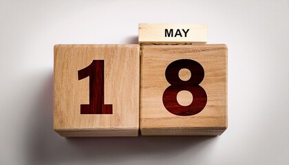 Minimalist photo of wooden blocks with date 18 May. Day and month, calendar on white background