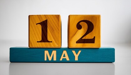 Minimalist photo of wooden blocks with date 12 May. Day and month, calendar on white background