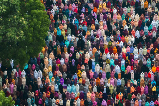 Bogura, Bangladesh - 11 April 2024: Aerial view of women gathered in colorful attire for Eid prayer, Bogura, Rajshahi, Bangladesh.