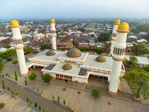 Aerial view of sultan bello mosque with domes and minarets in a historical cityscape, kaduna north, kaduna state, nigeria.