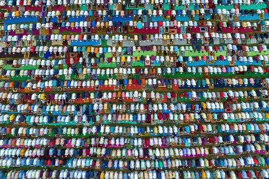 Aerial view of a colorful eid prayer gathering with a large crowd in rows, Mokamtala, Shibganj, Rajshahi, Bangladesh.
