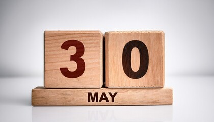Minimalist photo of wooden blocks with date 30 May. Day and month, calendar on white background