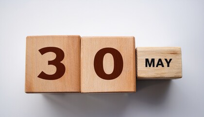 Minimalist photo of wooden blocks with date 30 May. Day and month, calendar on white background