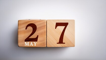 Minimalist photo of wooden blocks with date 27 May. Day and month, calendar on white background