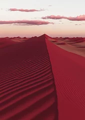 Red sand dunes under a pink sunset sky in desert landscape