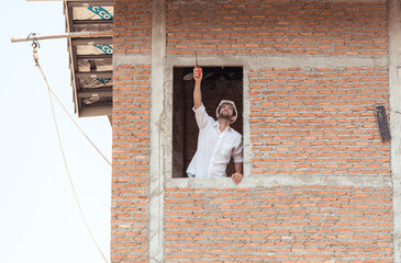 Portrait of engineers inspect and assess the residential home construction site's progress