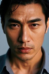 Fototapeta premium arafed asian man with a serious look on his face