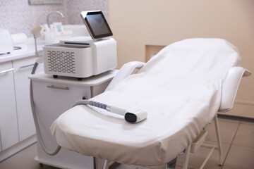 Laser hair removal machine and medical couch in beauty salon