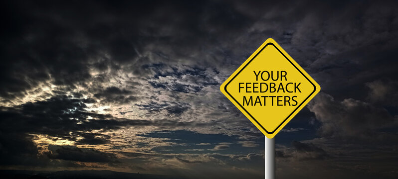 Top view image white paper card written text your feedback matters with a pen.