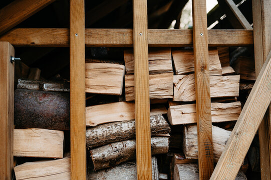 Stack of Chopped Firewood Logs with Natural Wood Grain Pattern