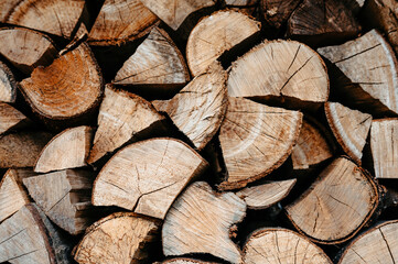 Stack of Chopped Firewood Logs with Natural Wood Grain Pattern
