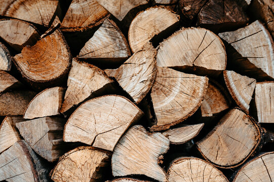 Stack of Chopped Firewood Logs with Natural Wood Grain Pattern