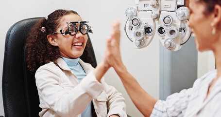 Eye care, high five or happy optician with child in clinic with diagnostic tool for prescription...
