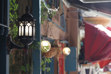 Charming lantern illuminates a quaint alleyway in an old town