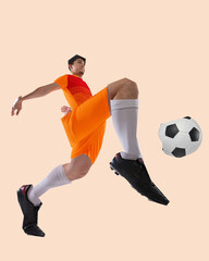 Dynamic male soccer player in orange uniform jumping forward toward ball with explosive energy over...