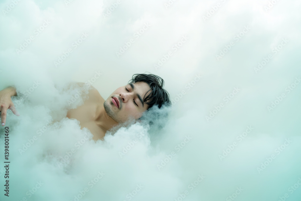 Aufkleber dreamy young man with closed eyes surrounded by soft white clouds on a light background, expressing 