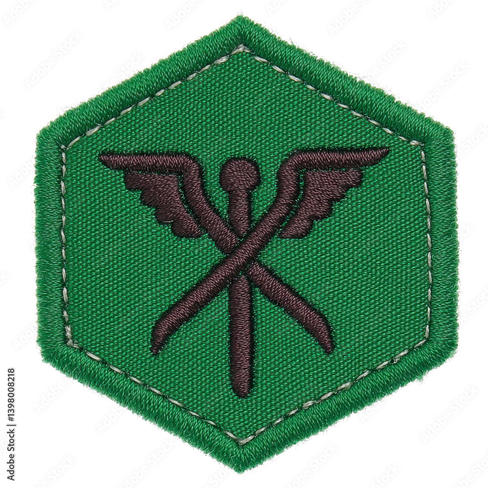 Poster This shows green hexagonal patch with design featuring crossed tools and wings, symbolizing mechanics or engineering. patch has stitched border, giving it rugged appearance