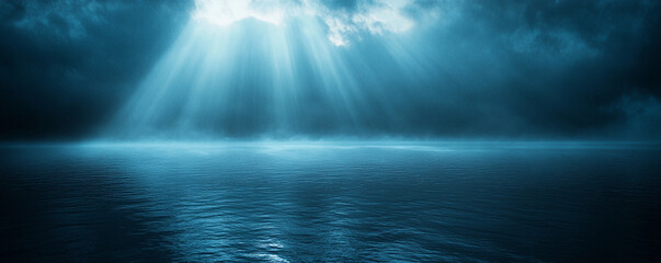 Mystical light beams pierce through dramatic clouds over calm ocean water at twilight