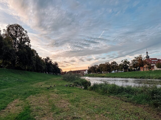 Beautiful, peaceful scene of a river with a small town in the background