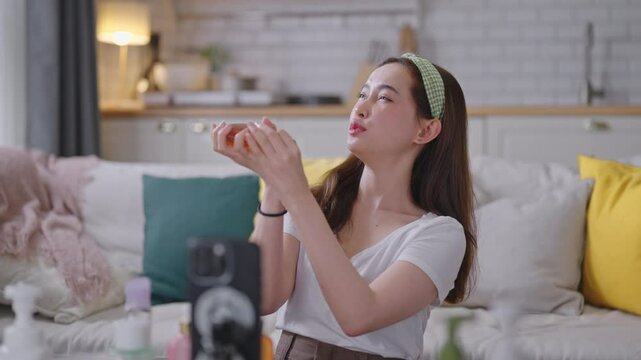 Asian beauty influencer live-streams and reviews cosmetics for her online audience.