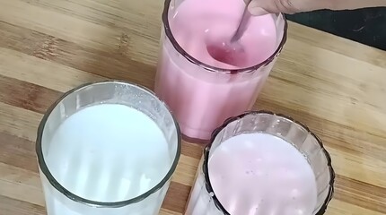 A colorful trio of buttermilk drinks, flavored with Rooh Afza syrup for a sweet, cooling twist.