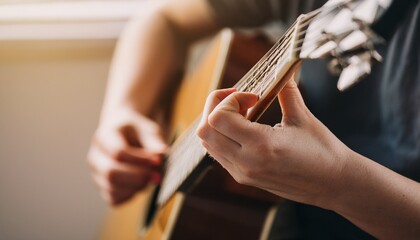 Fingers playing a guitar strings