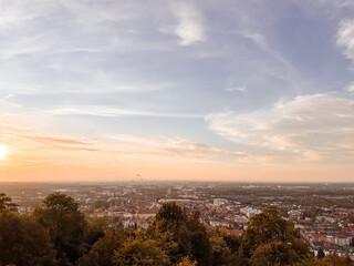 Beautiful sunset over a city with a few clouds in the sky