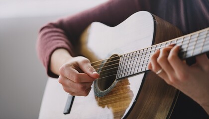 Fototapeta premium Fingers playing a guitar strings