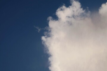 a cloud forms stratus with a blue sky background