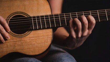 Fototapeta premium Fingers playing a guitar strings