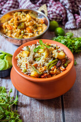 Navratan Pulao is a rich, aromatic Indian rice dish made with basmati rice, mixed vegetables, nuts, and dried fruits, offering a delightful sweet-savory flavor.