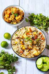 Aromatic Navratan Pulao: A Royal Medley of Fragrant Basmati Rice, Colorful Vegetables, Crunchy Nuts, Sweet Pineapple, and Rich Spices, Served with cucumber salad