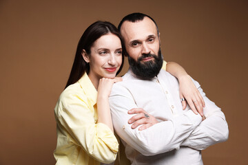 Fototapeta premium Happy daughter and father on brown background