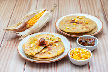 Corn cheese paratha is a delicious Indian flatbread stuffed with spiced sweet corn and melted cheese, perfect for breakfast or snacks.