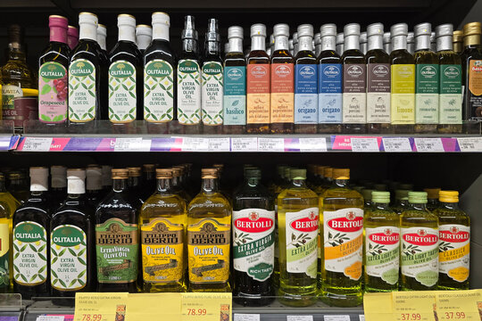Bangsar, Malaysia &ndash; Mar 29, 2025: Various bottles of olive oil from brands like Bertolli, Olitalia, and Filippo Berio neatly arranged on a supermarket shelf.