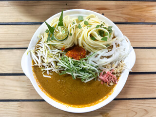 A bowl of Laksa Johor, a traditional dish from Johor, Malaysia.  Top view.