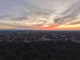 Experience the stunning beauty of a sunset over the cityscape with dramatic dancing clouds Hannover Lower Saxony