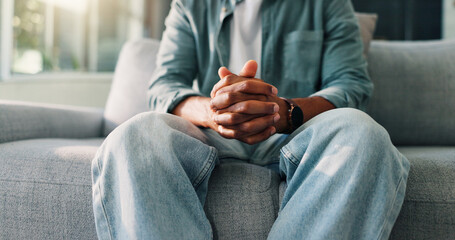 Hands together, psychology and person on sofa, stress and trauma counselling with depression....