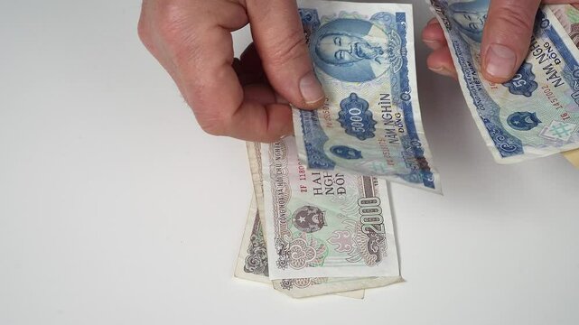 Counting Vietnamese dong banknotes
