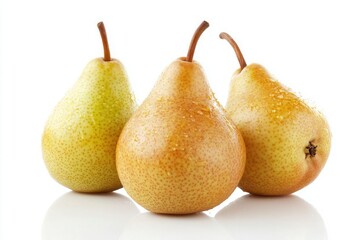 A close up shot of three pears of different colors sitting on a white surface with water droplets