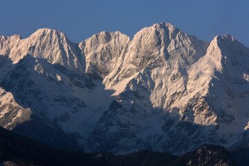 Obraz premium The snow-capped peaks of the High Tatras mountains (Mengusovske Stity) from viewpoint Pass over Lapszanka (Pass over Łapszanka), Podhale, Poland