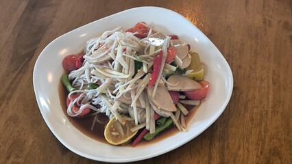Spicy papaya salad is a spicy dish in Thailand.