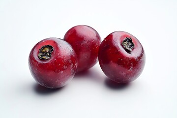 Three ripe red cherries on white background.
