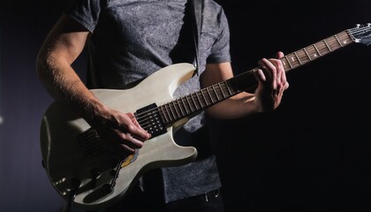 A person playing an electric guitar