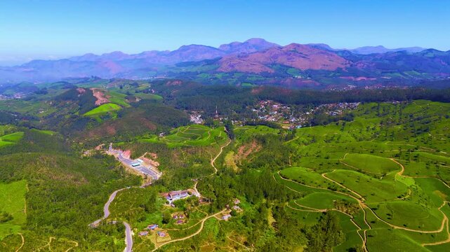 drone footage of Munnar hills covered in greenery in karela