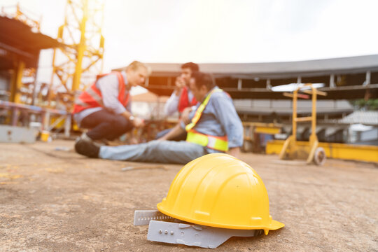 Men, construction, architect have accident during construction on site. Construction builder worker accident at construction site. Industrial accident. Health safe of work and safety first concept