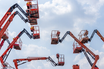 Articulate boom lift with blue sky background, Aerial platform lift telescopic boom lift hydraulic...